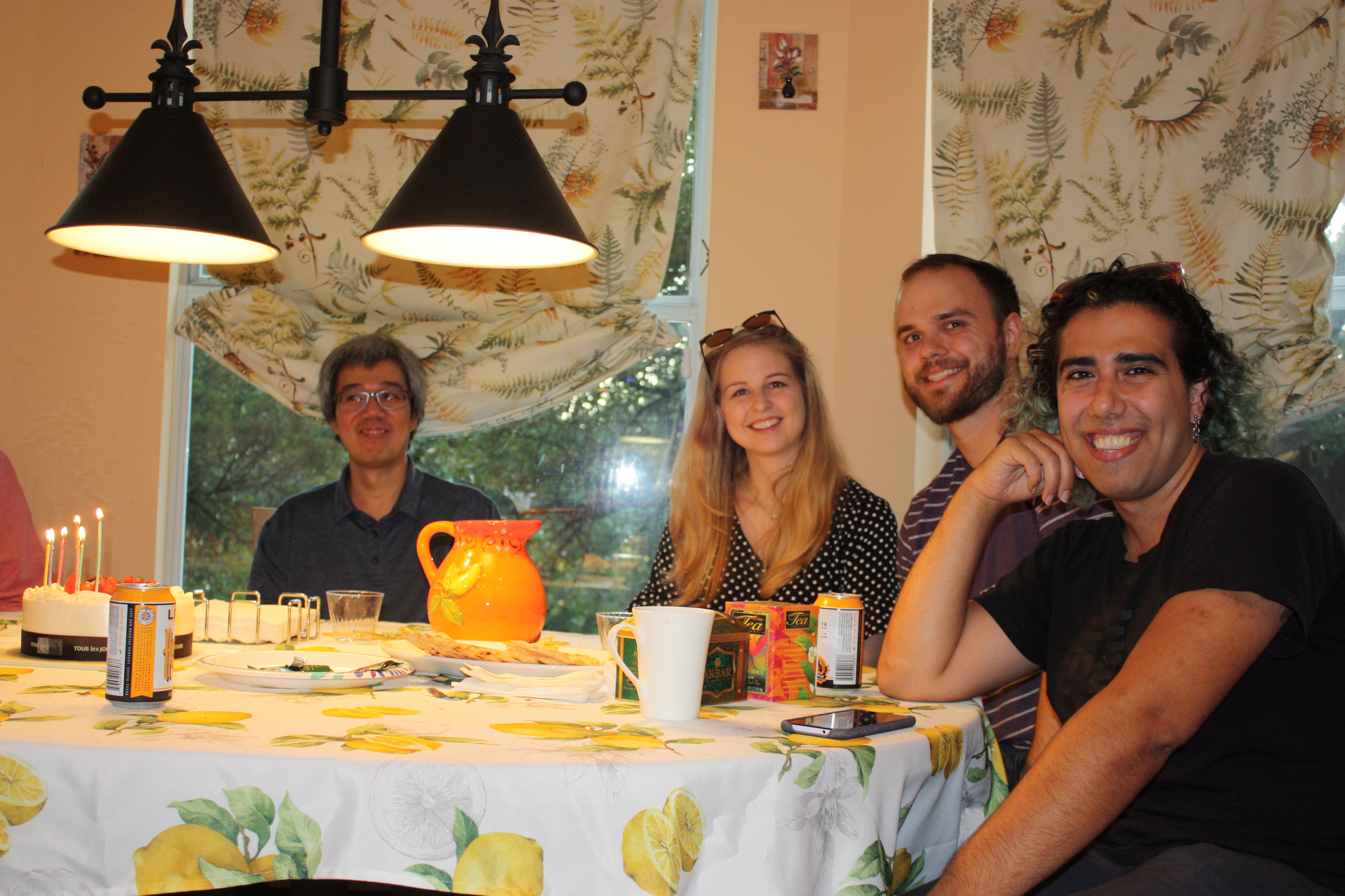 Agham, Lauren, Marc, and Ali smiling.